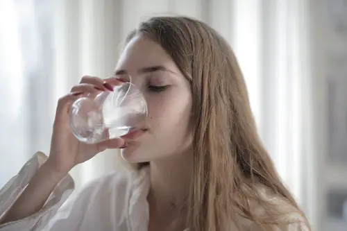 Young lady consuming water